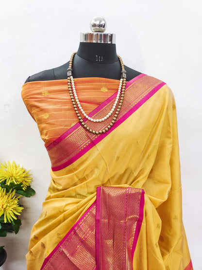 Golden Yellow Cotton Silk Saree with Rani Pink Zari Border & Peach Contrast Blouse