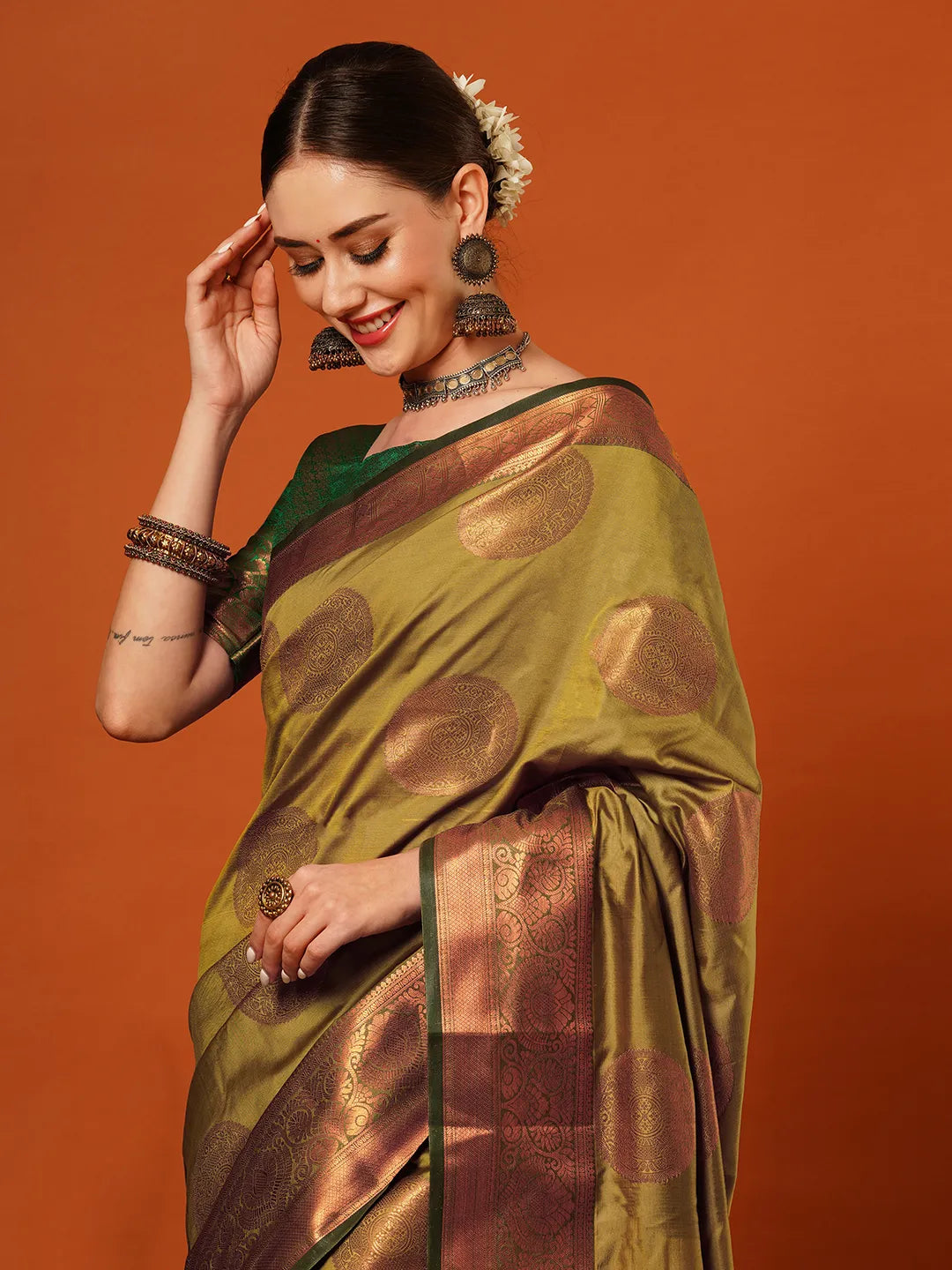 Lemon Green Banarasi Silk Saree with Antique Copper Zari Circular Buttas & Emerald Green Woven Pallu