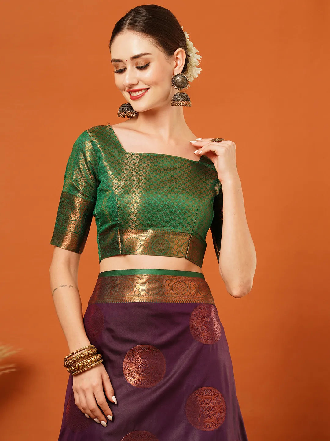 Wine Purple Banarasi Silk Saree with Antique Copper Zari Circular Buttas & Emerald Green Woven Pallu