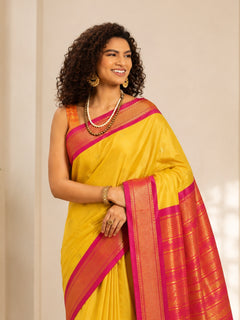 Golden Yellow Cotton Silk Saree with Rani Pink Zari Border & Peach Contrast Blouse