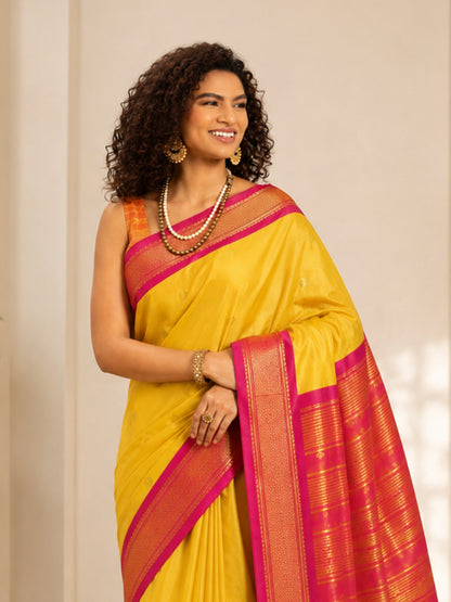 Golden Yellow Cotton Silk Saree with Rani Pink Zari Border & Peach Contrast Blouse